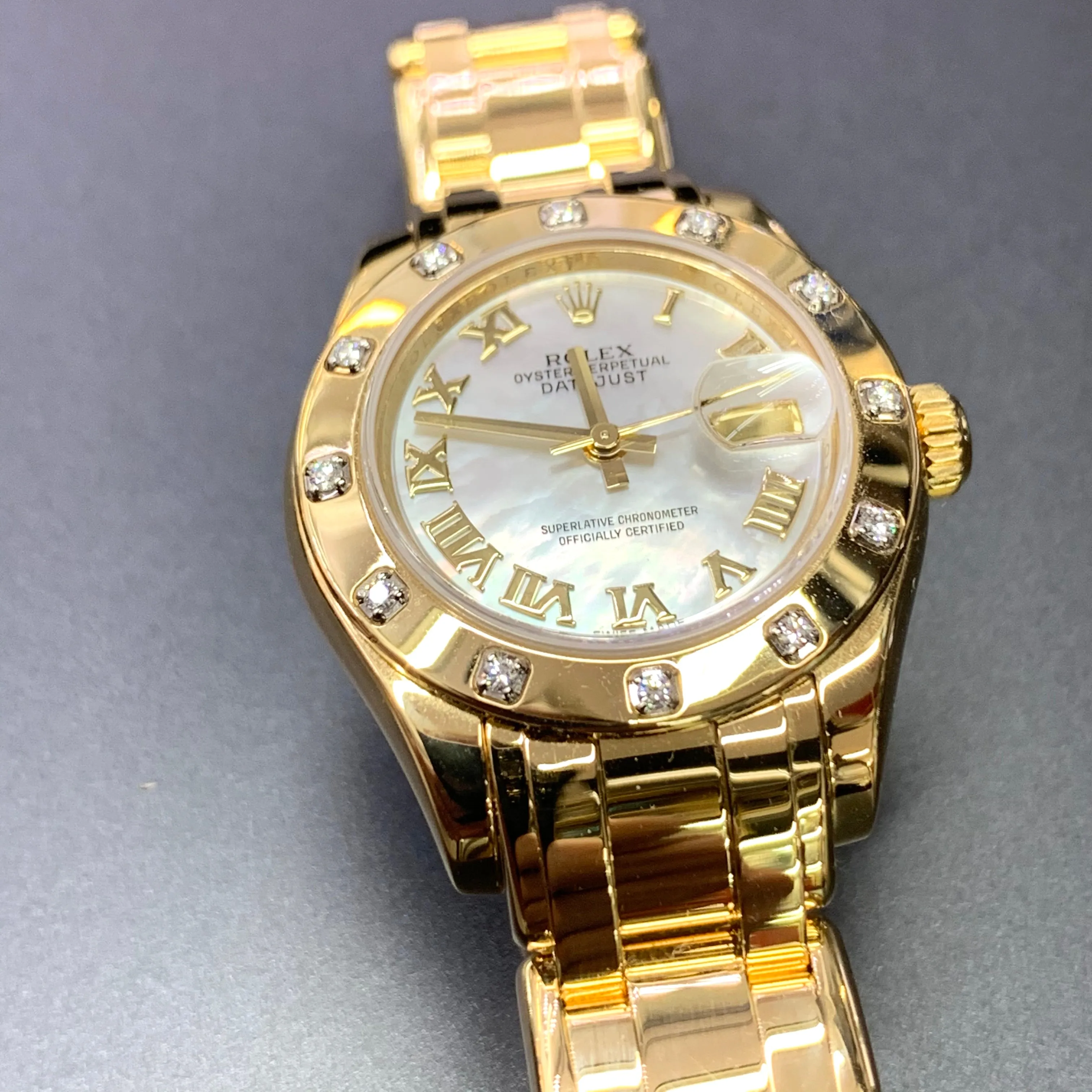 Rolex Datejust Pearlmaster 29mm Ladies 18kt Yellow Gold 12 Diamond Bezel (MOP dial)